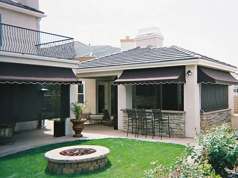 A house with a fire pit in front of it