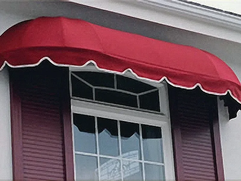 A window with a red awning over it